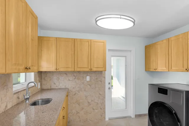 a kitchen with a sink and a cabinets