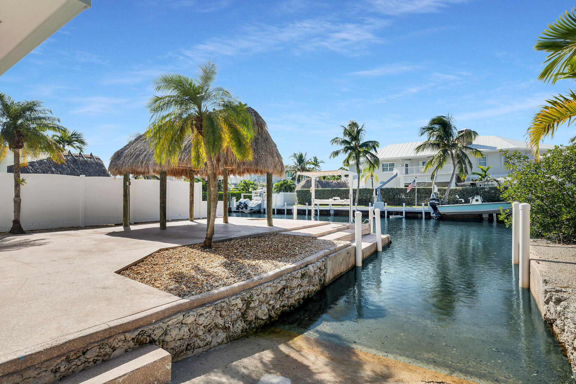251 Azalea Street Tavernier, FL 33070 - Photo 4 of 58 a view of a swimming pool with lounge chairs