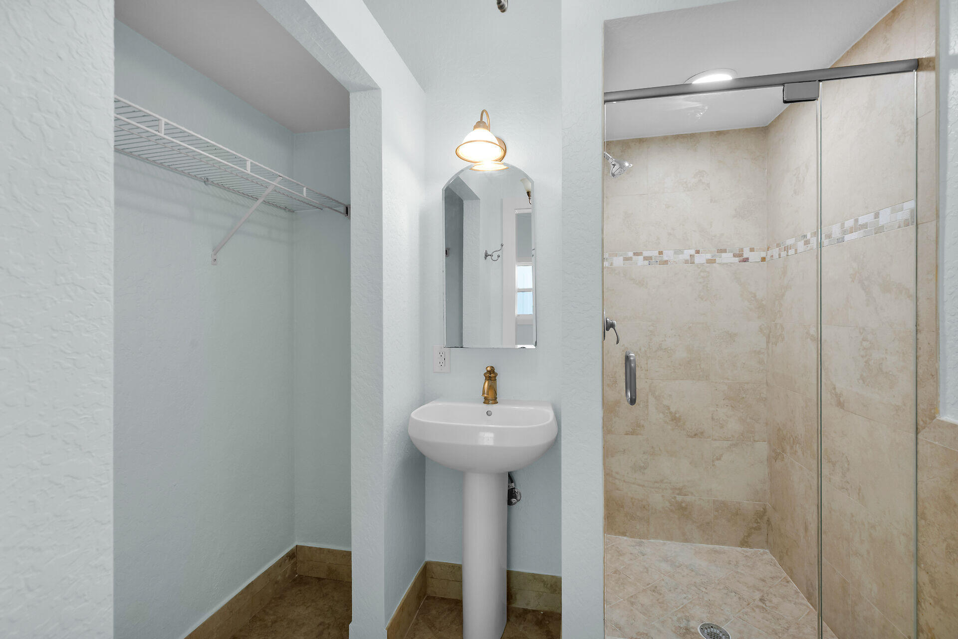 251 Azalea Street Tavernier, FL 33070 - Photo 41 of 58 a bathroom with a sink a mirror and shower