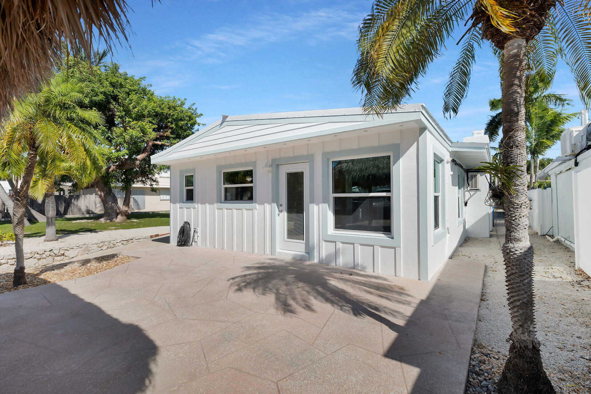 251 Azalea Street Tavernier, FL 33070 - Photo 44 of 58 a view of a house with a patio