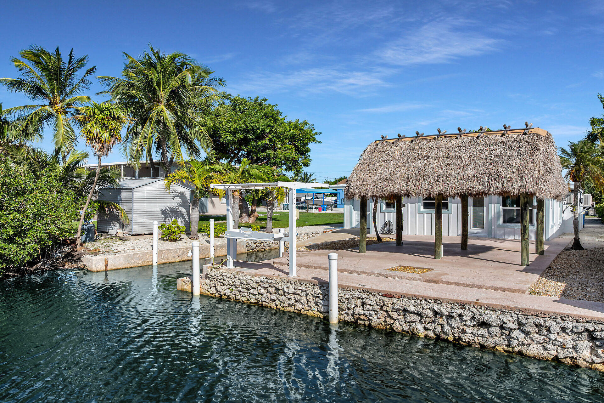 251 Azalea Street Tavernier, FL 33070 - Photo 47 of 58 a view of a house with wooden fence