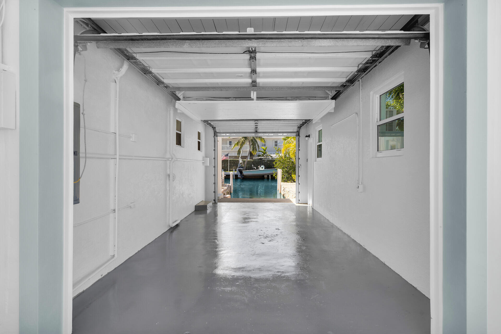 251 Azalea Street Tavernier, FL 33070 - Photo 48 of 58 a view of hallway with wooden floor and a ceiling fan