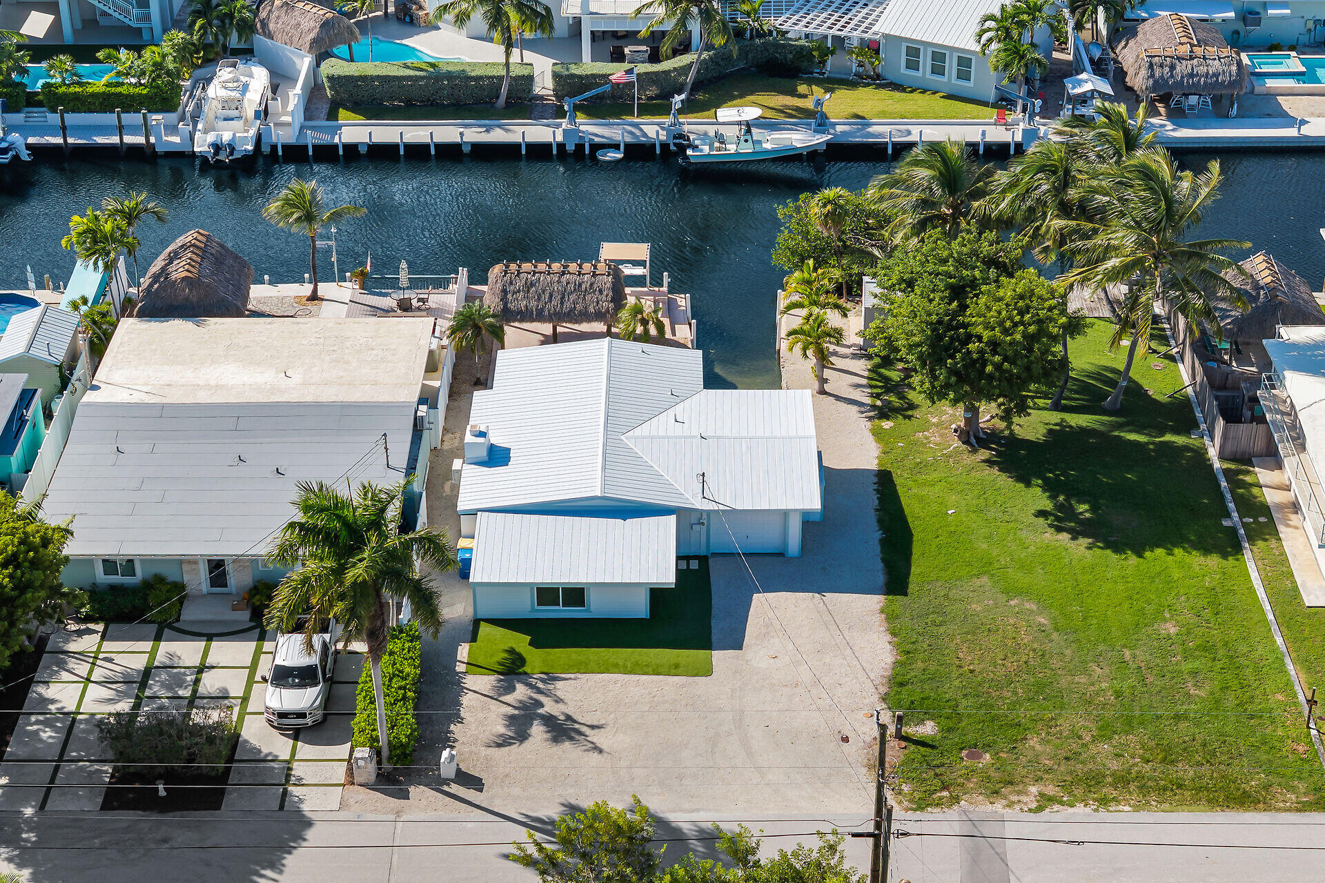 251 Azalea Street Tavernier, FL 33070 - Photo 49 of 58 an aerial view of a house with a garden and lake view