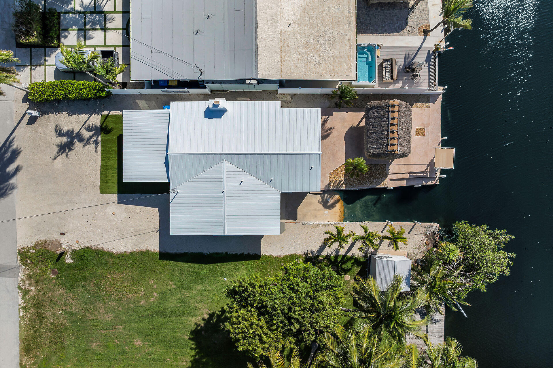 251 Azalea Street Tavernier, FL 33070 - Photo 51 of 58 an aerial view of a house with a yard and garden