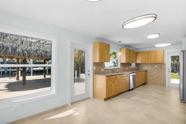 a kitchen with a sink and a window
