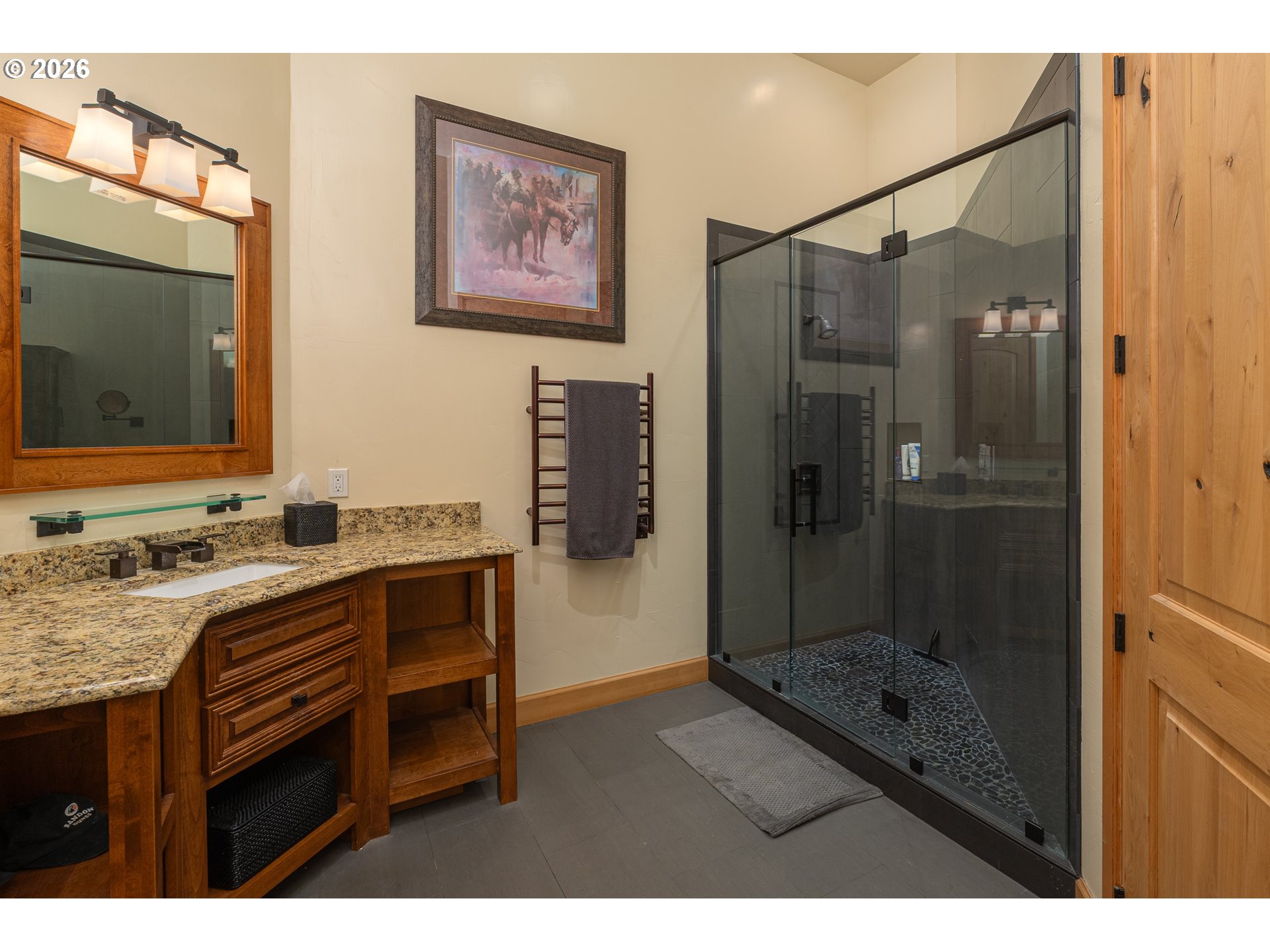 94880 Grizzly Mountain Road Gold Beach, OR 97444 - Photo 36 of 48 a bathroom with a granite countertop sink a mirror a shower and vanity