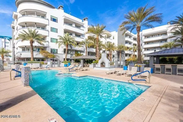 a view of a building with a swimming pool
