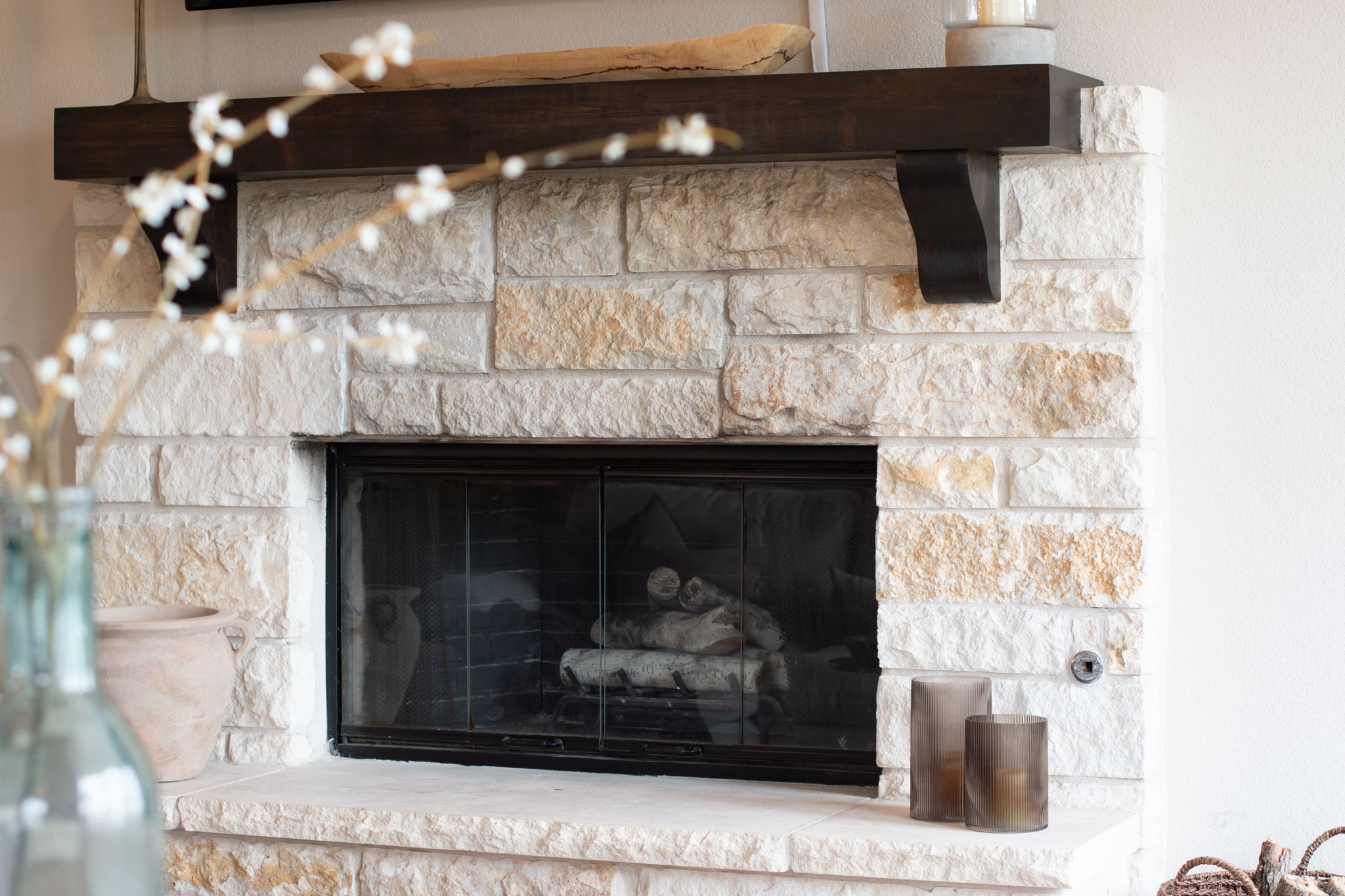155 Balcones Ridge Way Bertram, TX 78605 - Photo 19 of 37 The fireplace has decorative logs and propane gas, but can also burn genuine wood.