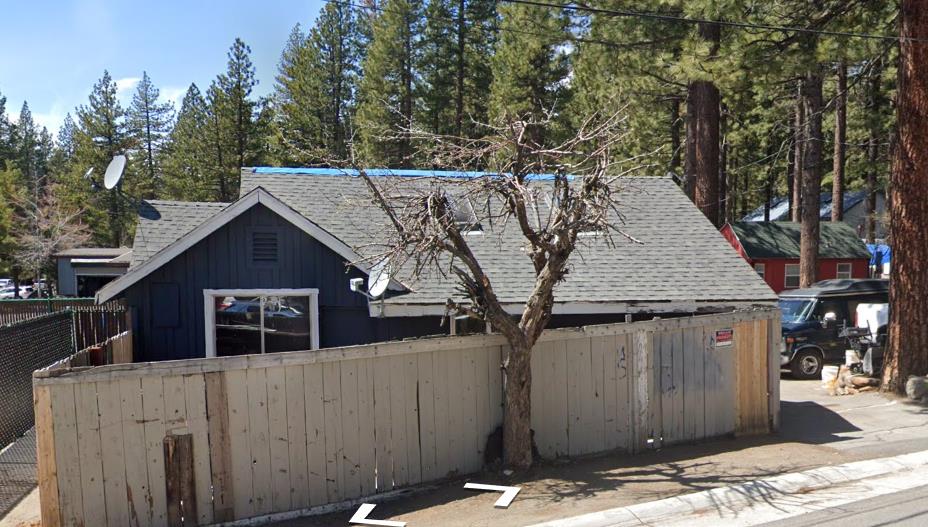 217 Chipmunk Street Kings Beach, CA 96143 - Photo 6 of 18 a house with trees in the background