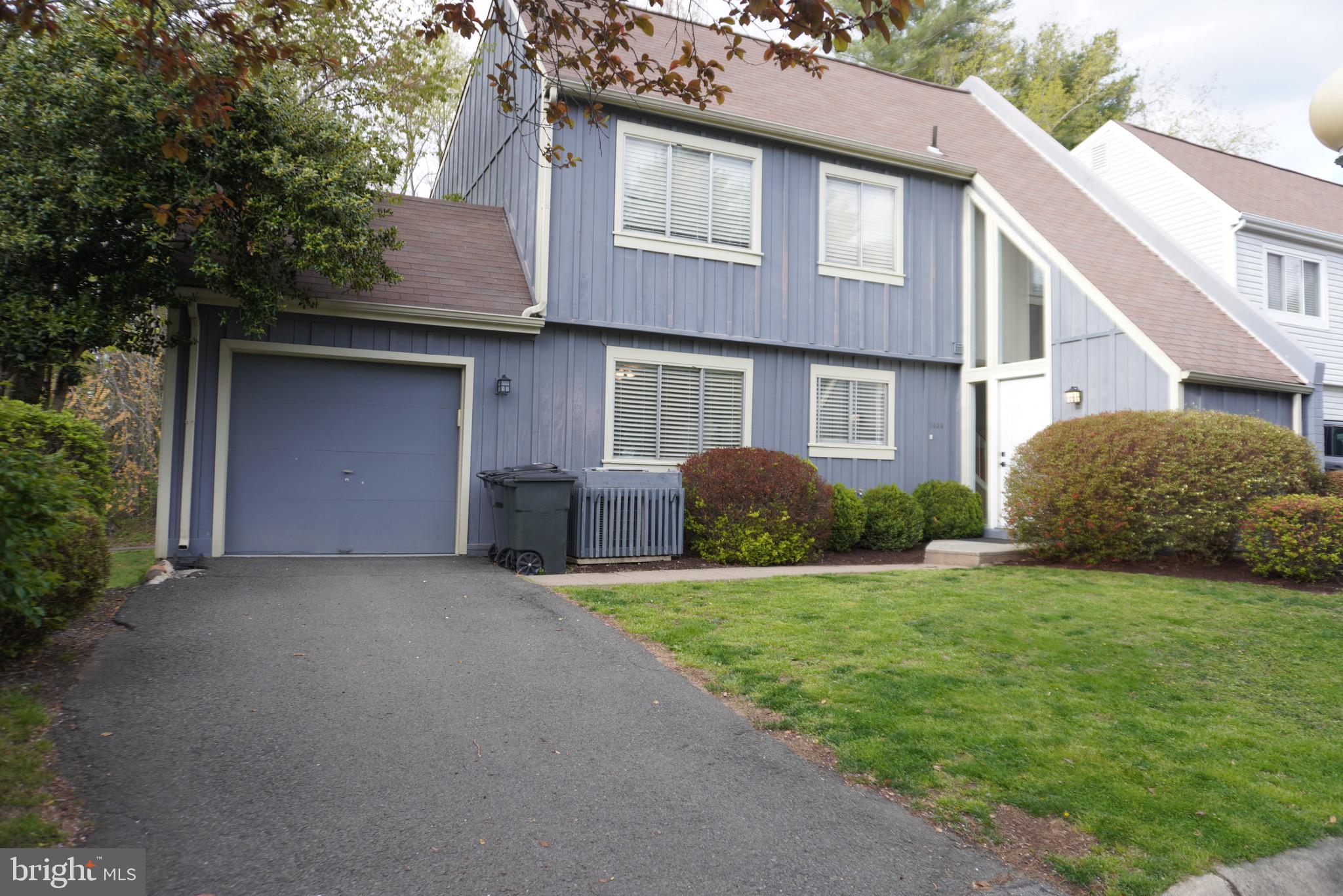 1434 Yellowwood Court Reston, VA 20190 - Photo 1 of 17 a view of a house with a yard and large tree