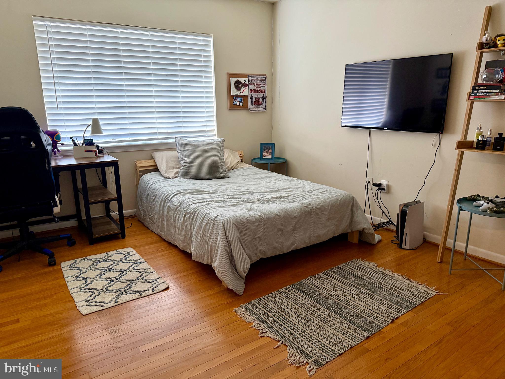 1434 Yellowwood Court Reston, VA 20190 - Photo 11 of 17 a bedroom with a bed and wooden floor