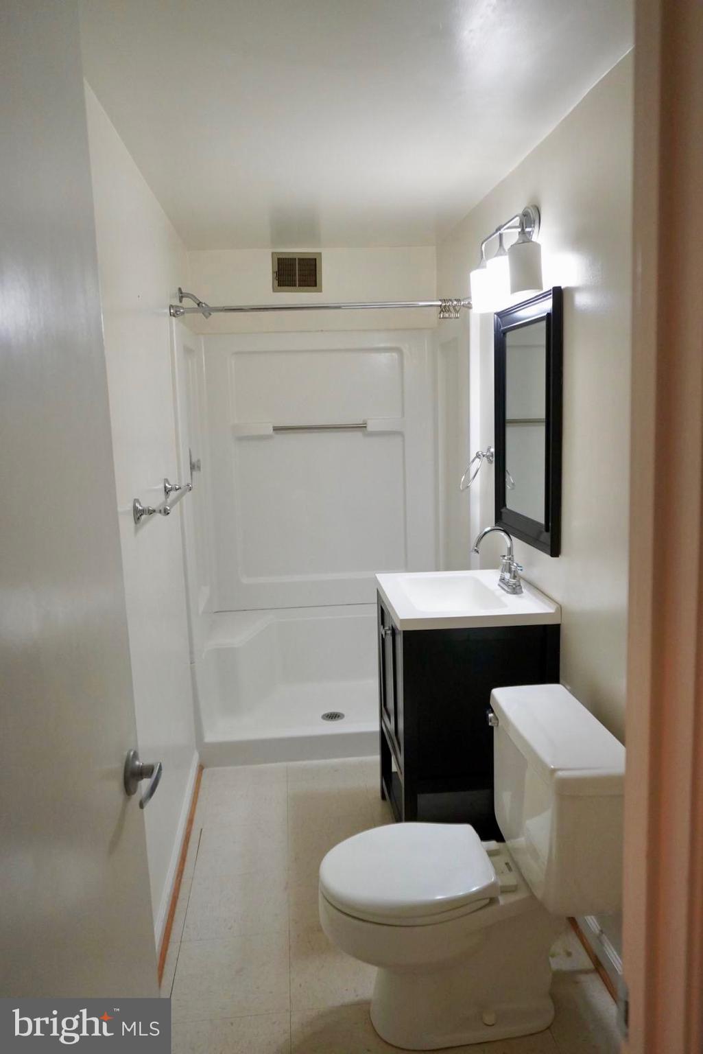 1434 Yellowwood Court Reston, VA 20190 - Photo 15 of 17 a bathroom with a sink a toilet and shower