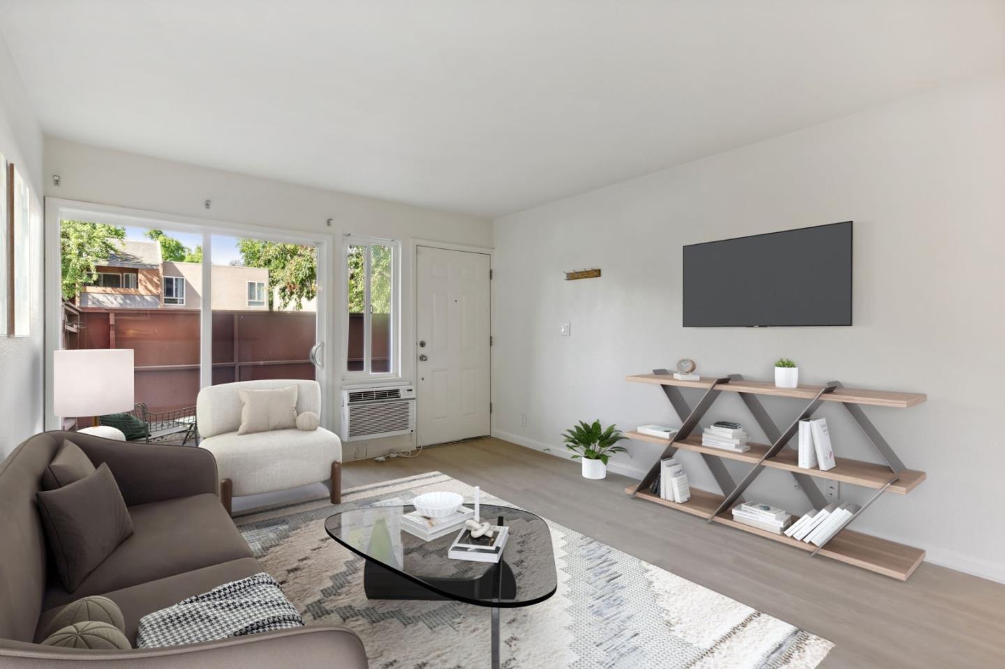 492 Dempsey Road, Unit 194 Milpitas, CA 95035 - Photo 3 of 27 a living room with furniture and a flat screen tv