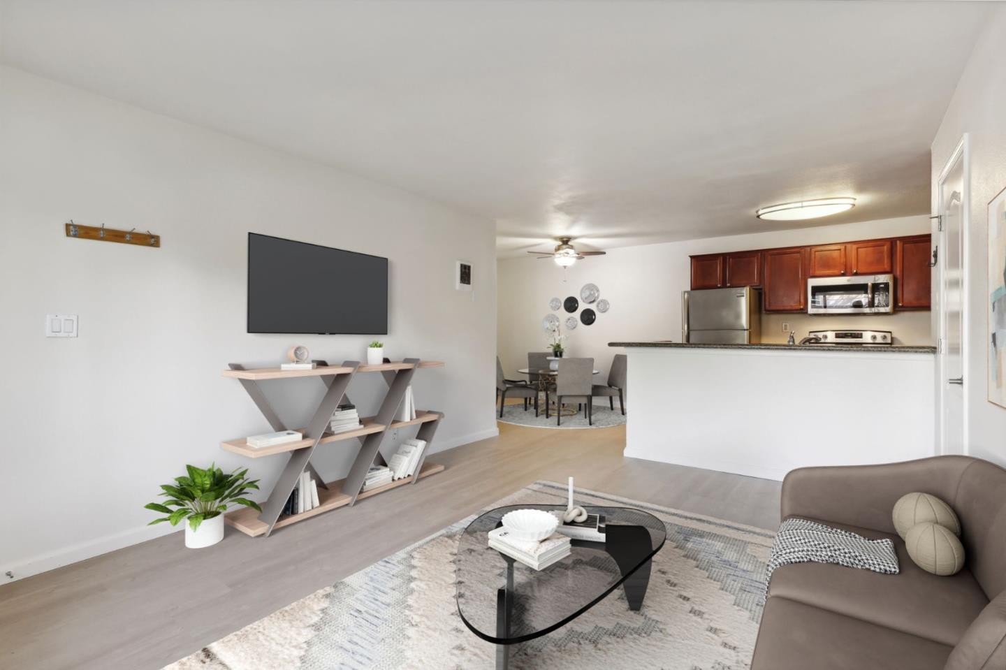 492 Dempsey Road, Unit 194 Milpitas, CA 95035 - Photo 4 of 27 a living room with furniture and a flat screen tv