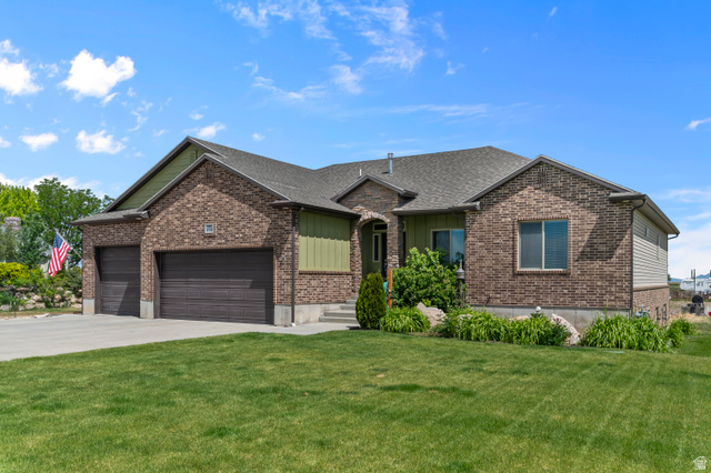 5702 950 North Ogden, UT 84404 - Photo 2 of 36 Brick exterior with complementary green siding accents