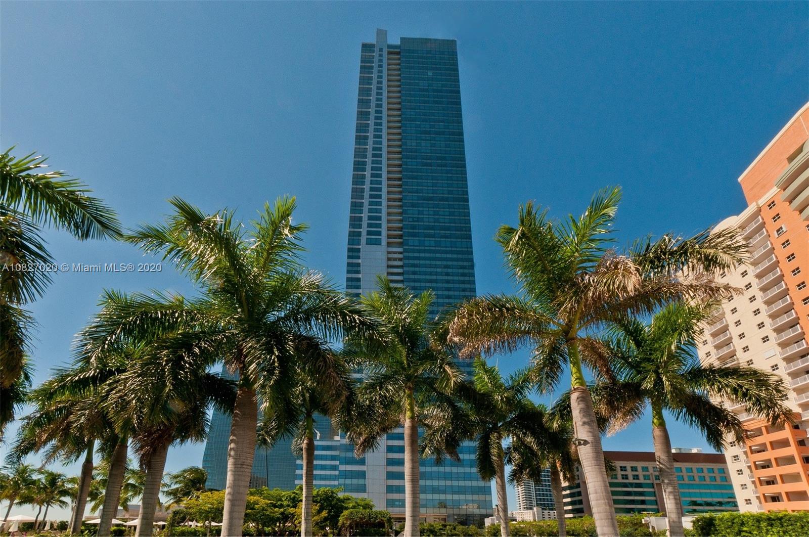 1425 Brickell Avenue, Unit 44D Miami, FL 33131 - Photo 1 of 1 a plant is in front of a building