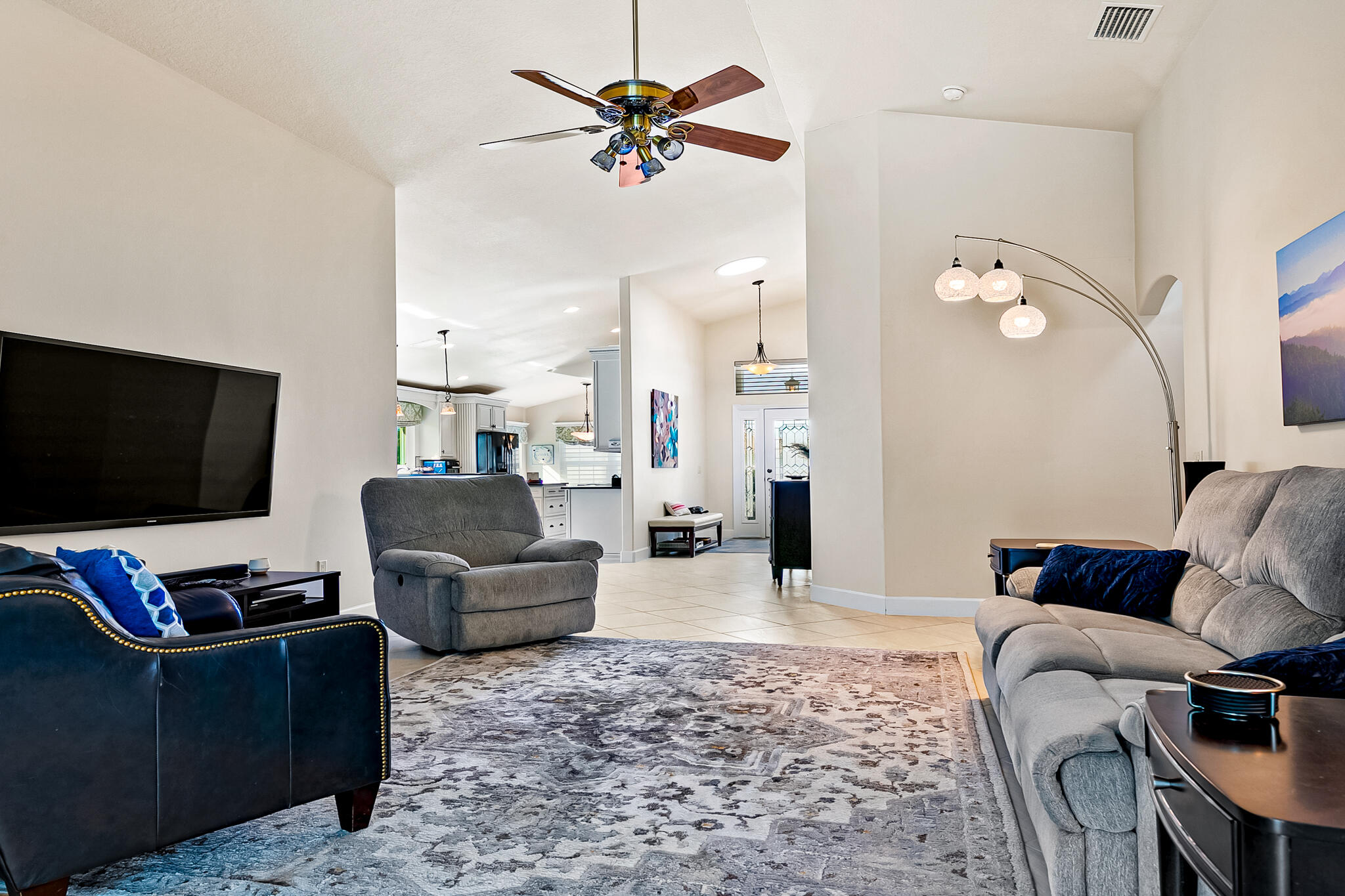 1605 Boca Rio Drive Melbourne, FL 32940 - Photo 13 of 55 a living room with furniture and a flat screen tv