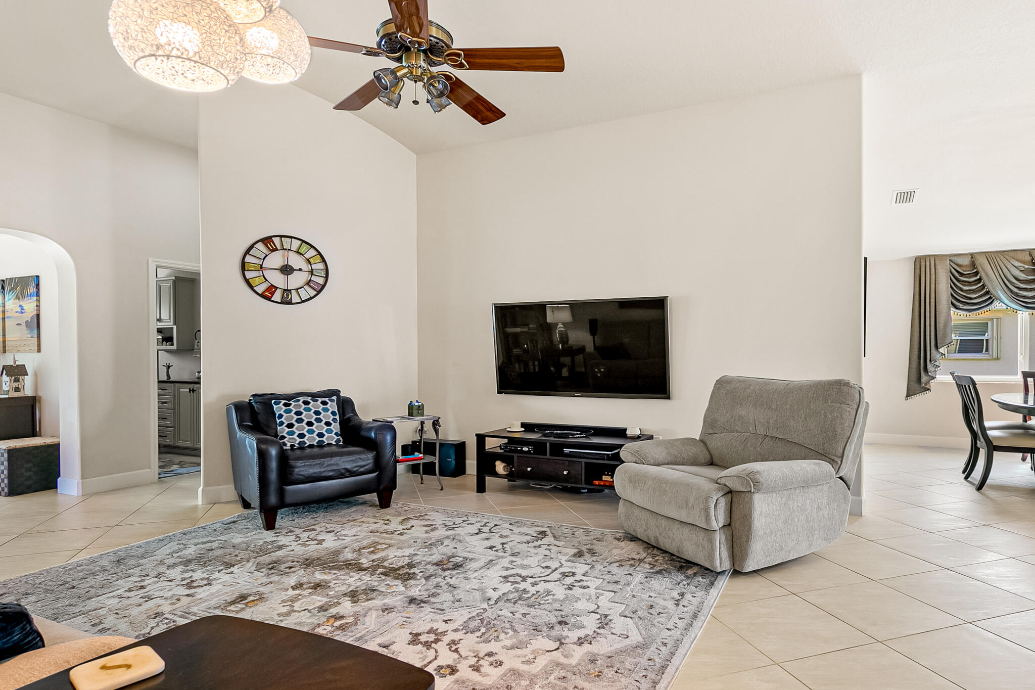 1605 Boca Rio Drive Melbourne, FL 32940 - Photo 14 of 55 a living room with furniture and a flat screen tv