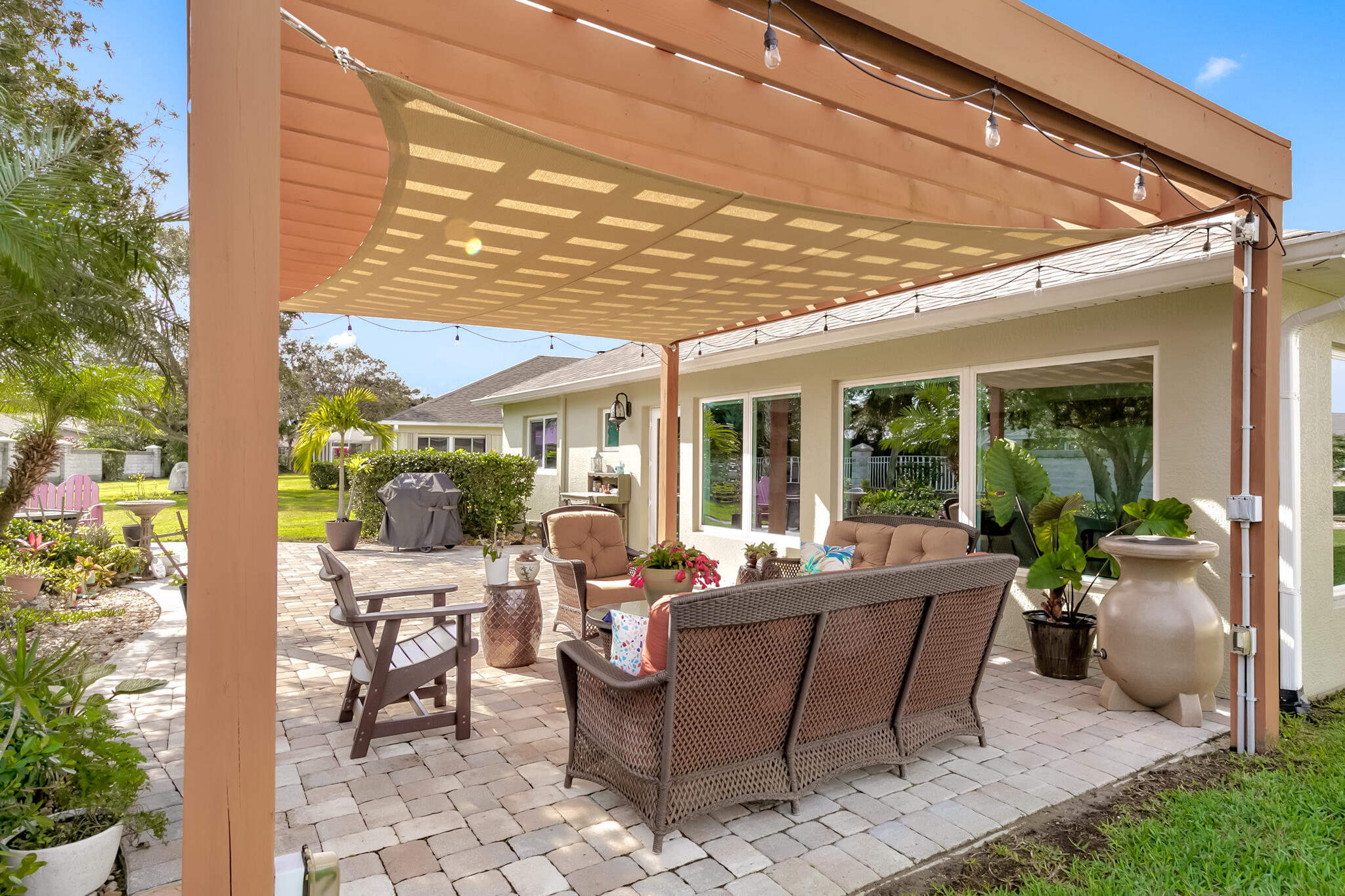 1605 Boca Rio Drive Melbourne, FL 32940 - Photo 31 of 55 a view of a patio with table and chairs and potted plants