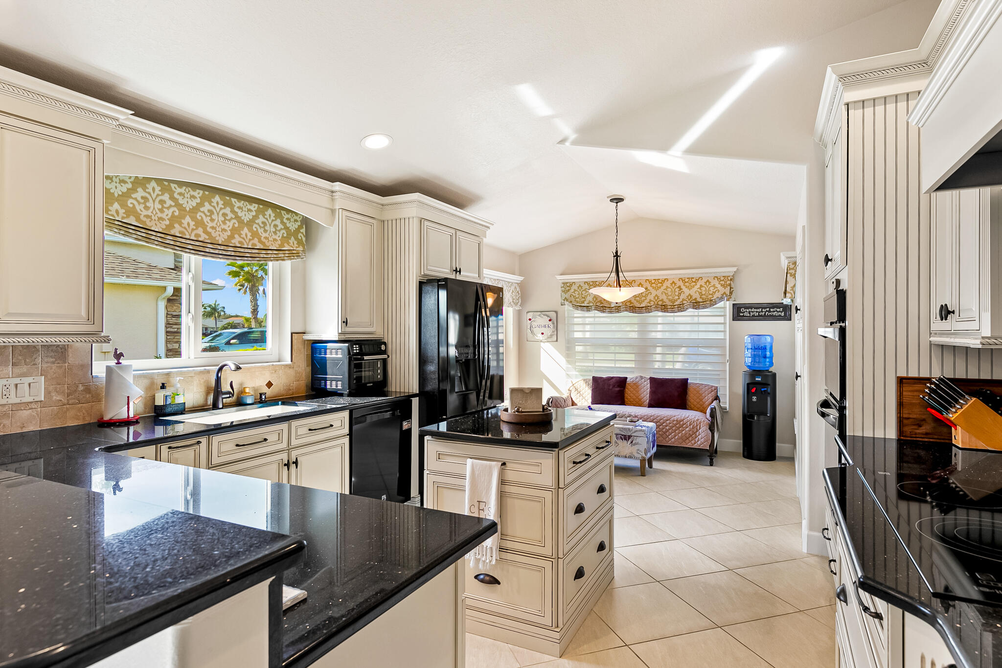 1605 Boca Rio Drive Melbourne, FL 32940 - Photo 4 of 55 a kitchen with stainless steel appliances granite countertop a sink stove and refrigerator