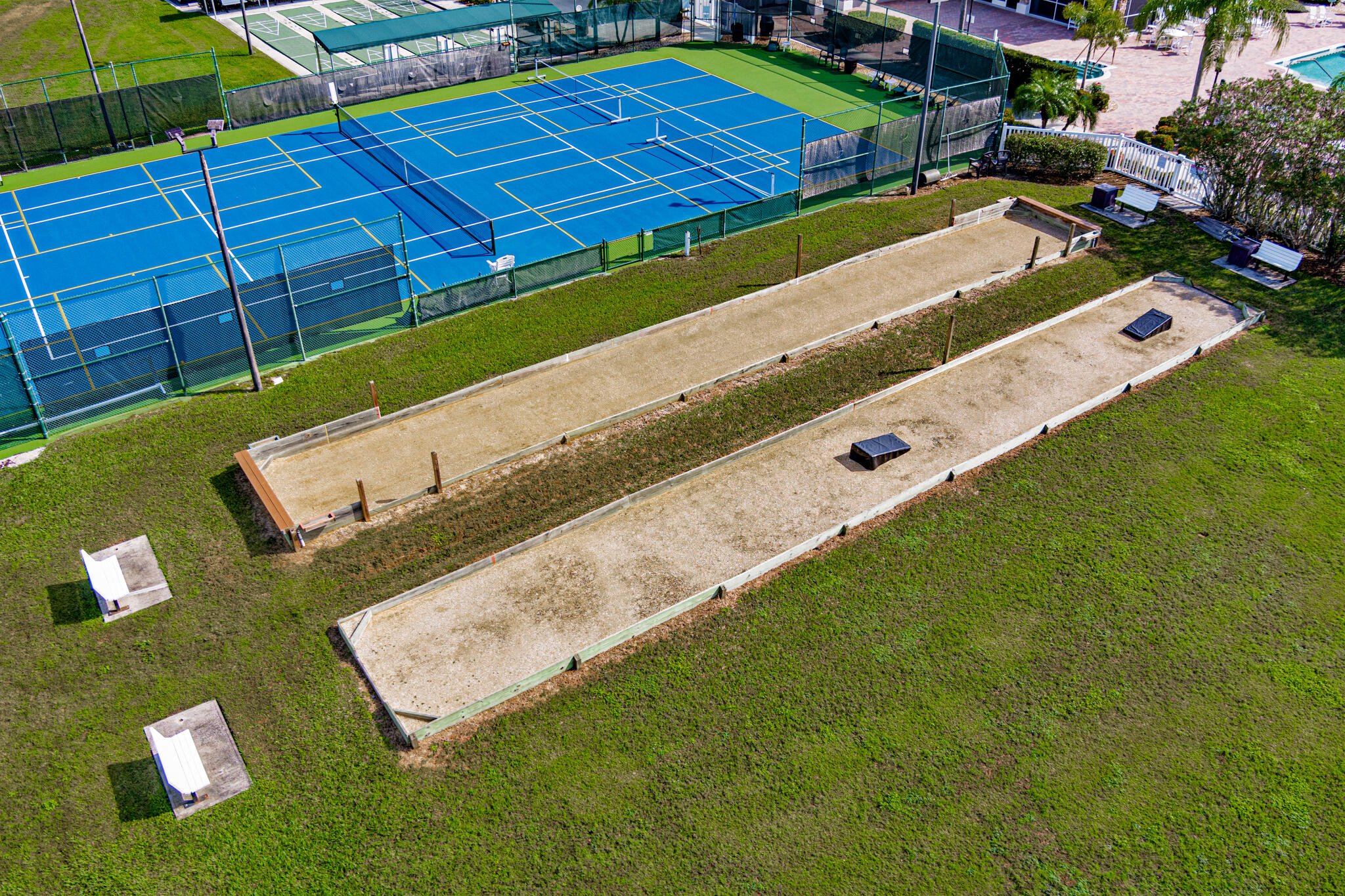 1605 Boca Rio Drive Melbourne, FL 32940 - Photo 42 of 55 a view of a tennis ground with large trees