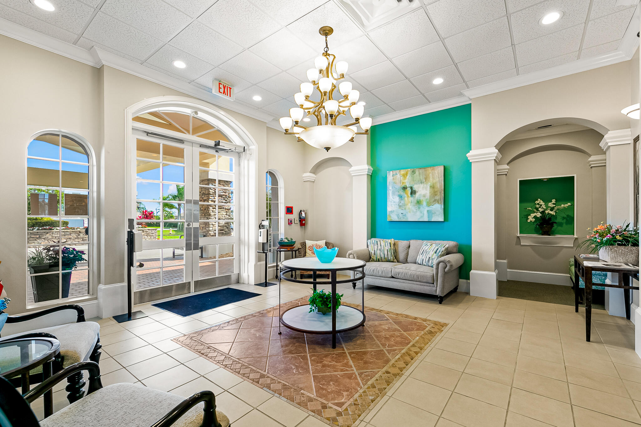 1605 Boca Rio Drive Melbourne, FL 32940 - Photo 47 of 55 a living room with fireplace furniture and a chandelier