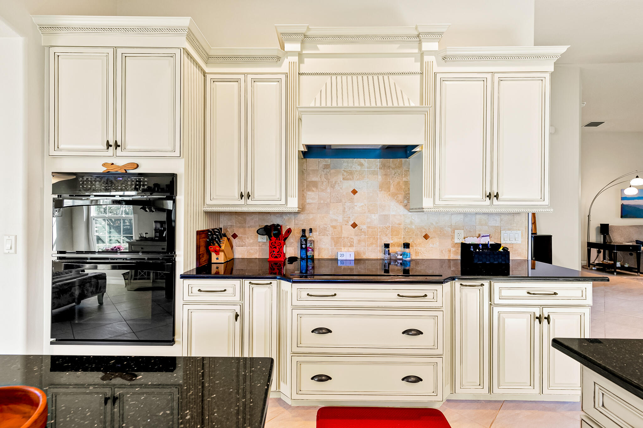 1605 Boca Rio Drive Melbourne, FL 32940 - Photo 5 of 55 a kitchen with stainless steel appliances white cabinets and a refrigerator