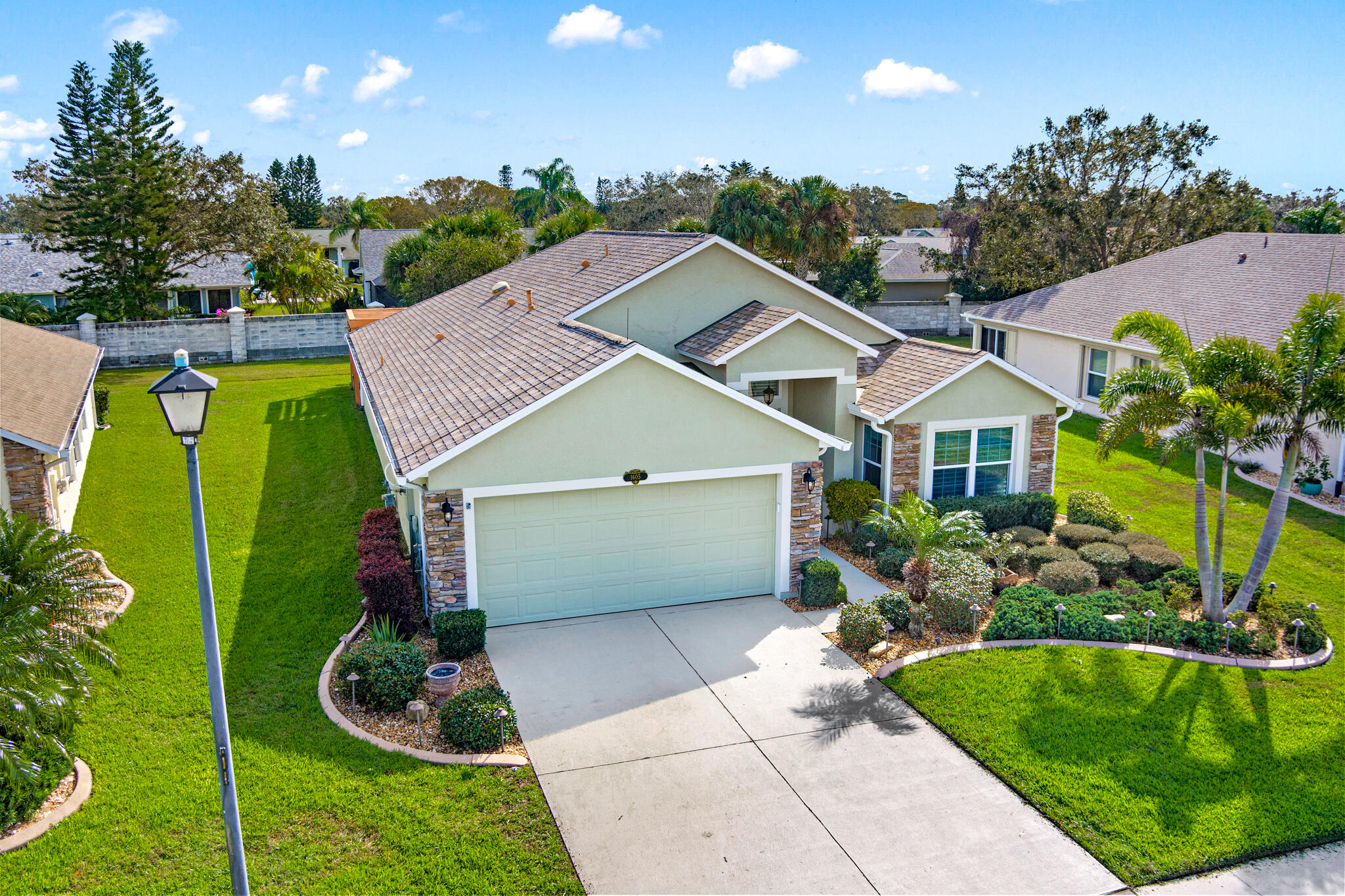 1605 Boca Rio Drive Melbourne, FL 32940 - Photo 54 of 55 a aerial view of a house with garden and plants