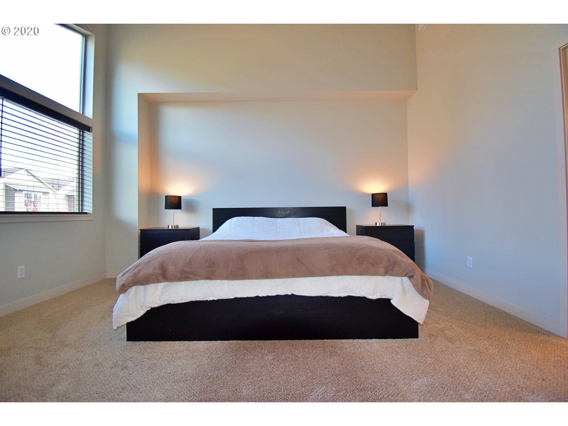 161 North 44th Place Ridgefield, WA 98642 - Photo 20 of 32 a bedroom with a bed and a night stand