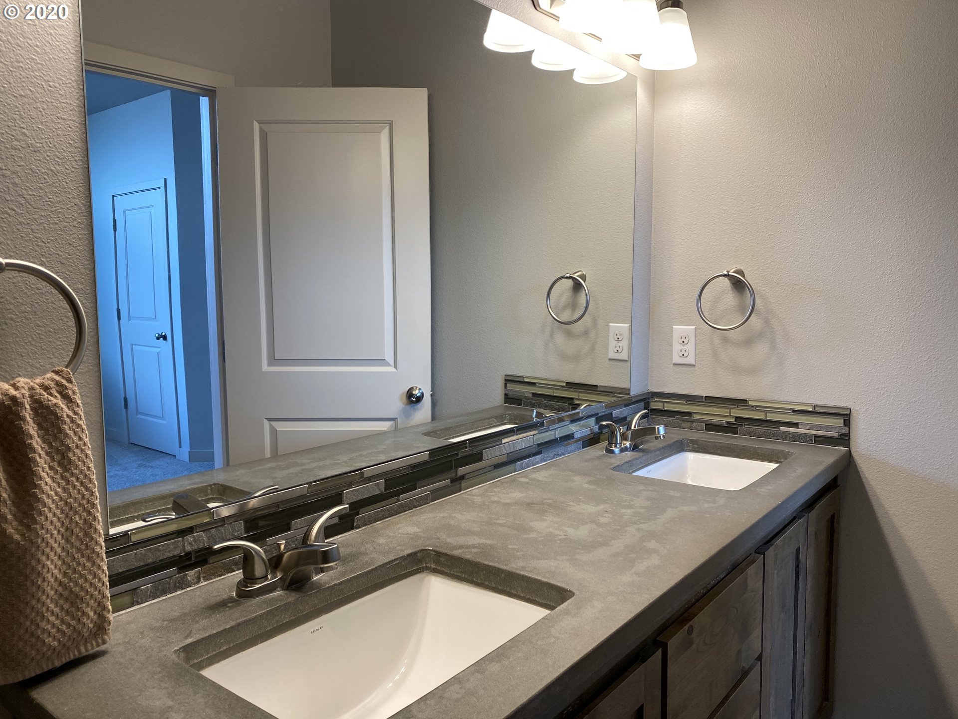 161 North 44th Place Ridgefield, WA 98642 - Photo 24 of 32 a bathroom with a granite countertop sink and a mirror