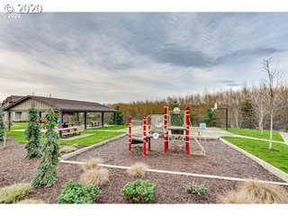 161 North 44th Place Ridgefield, WA 98642 - Photo 30 of 32 a backyard of a house with table and chairs