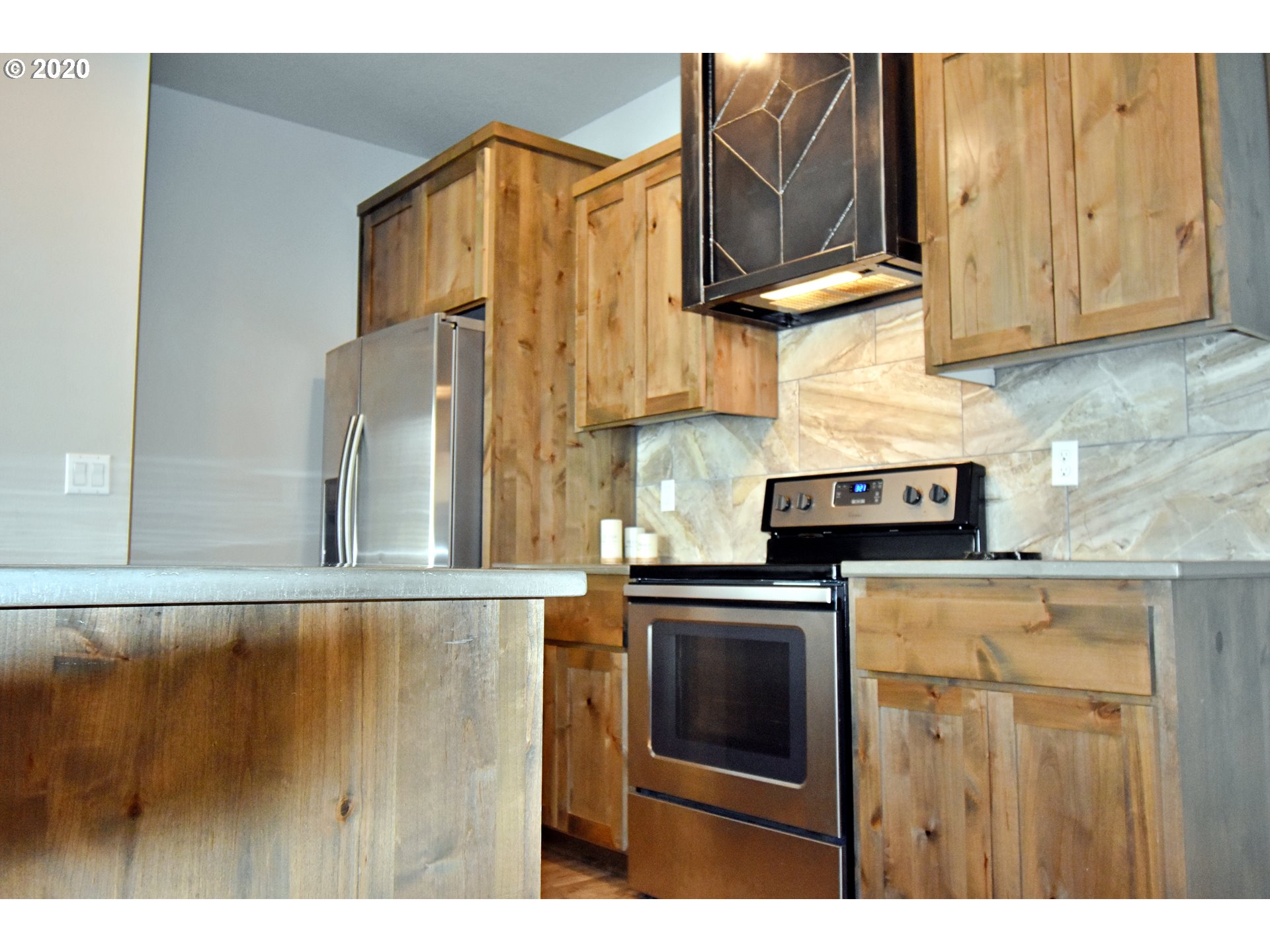161 North 44th Place Ridgefield, WA 98642 - Photo 8 of 32 a kitchen with stainless steel appliances granite countertop a stove and a microwave