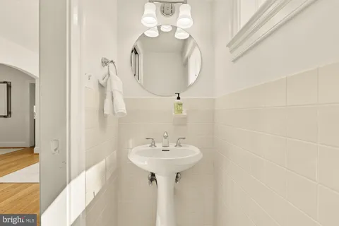 a bathroom with a sink a mirror and a shower
