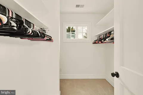 a view of a closet with storage