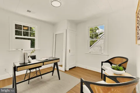 a living room with a couch and a window