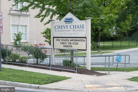a view of a street sign of a house and a park view