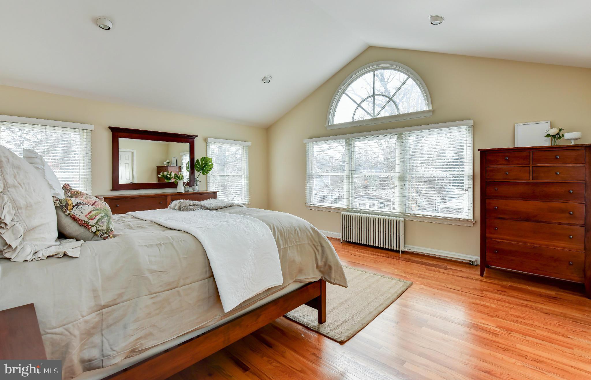 2806 Ridge Rd Drive Alexandria, VA 22302 - Photo 13 of 30 a bedroom with a bed and wooden floor