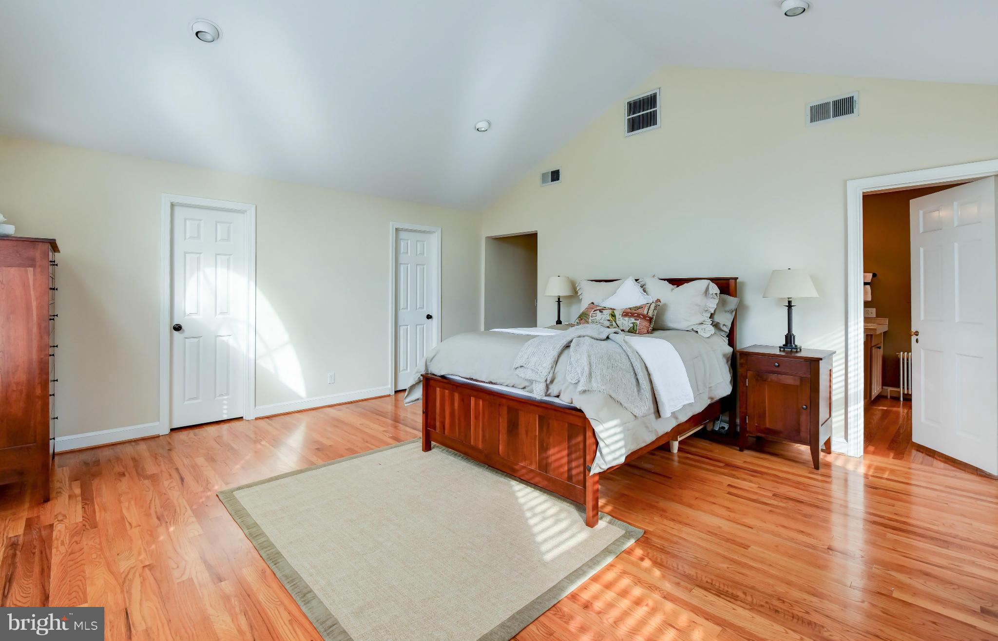2806 Ridge Rd Drive Alexandria, VA 22302 - Photo 14 of 30 a bedroom with a bed and wooden floor