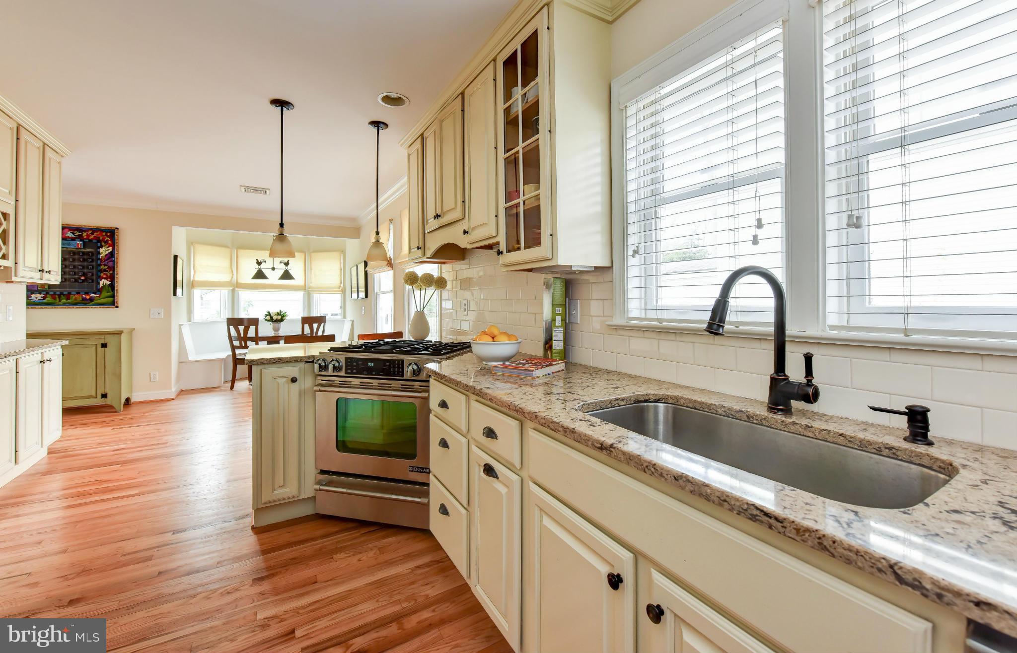 2806 Ridge Rd Drive Alexandria, VA 22302 - Photo 6 of 30 a kitchen with stainless steel appliances granite countertop a sink a stove and a wooden floors