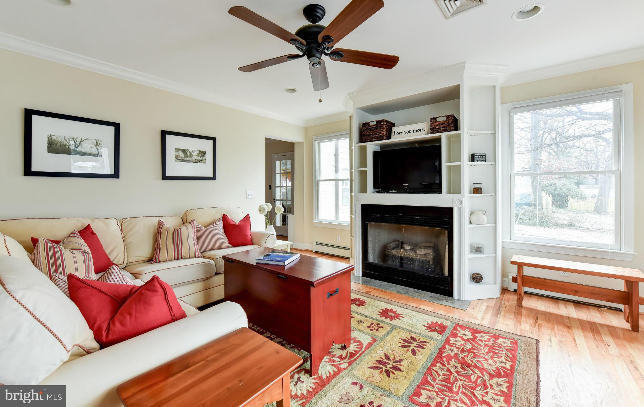 2806 Ridge Rd Drive Alexandria, VA 22302 - Photo 9 of 30 a living room with furniture a flat screen tv and a fireplace