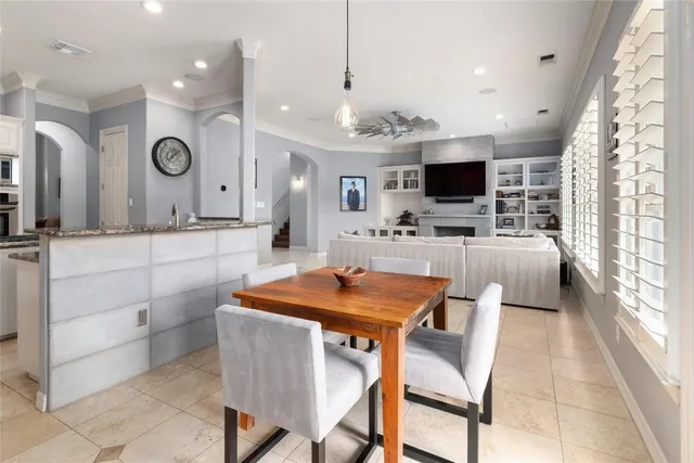 a view of a dining room kitchen with furniture and a flat screen tv