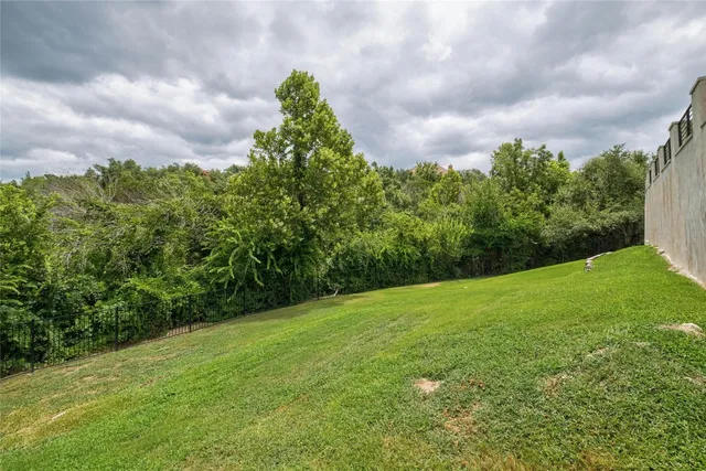 a backyard of a house with lots of green space