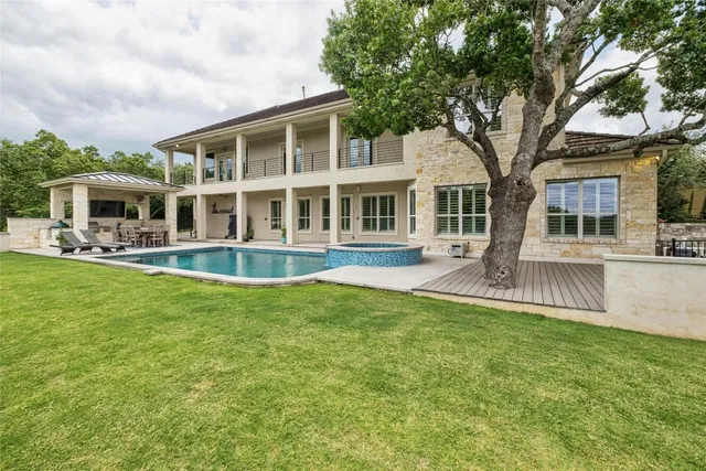 a front view of a house with a yard table and chairs