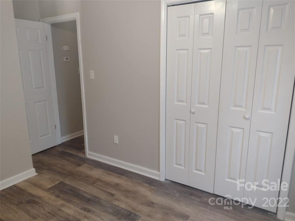 111 Sunset Drive Clover, SC 29710 - Photo 11 of 12 an empty room with wooden floor