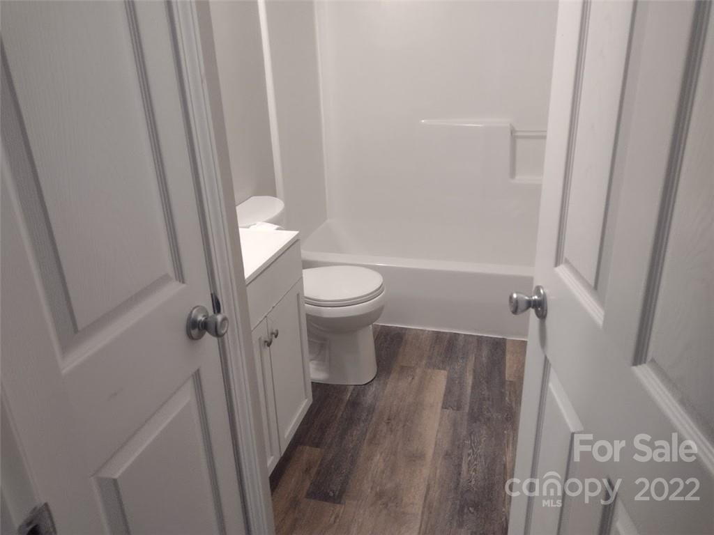 111 Sunset Drive Clover, SC 29710 - Photo 12 of 12 a bathroom with a toilet a sink and a shower