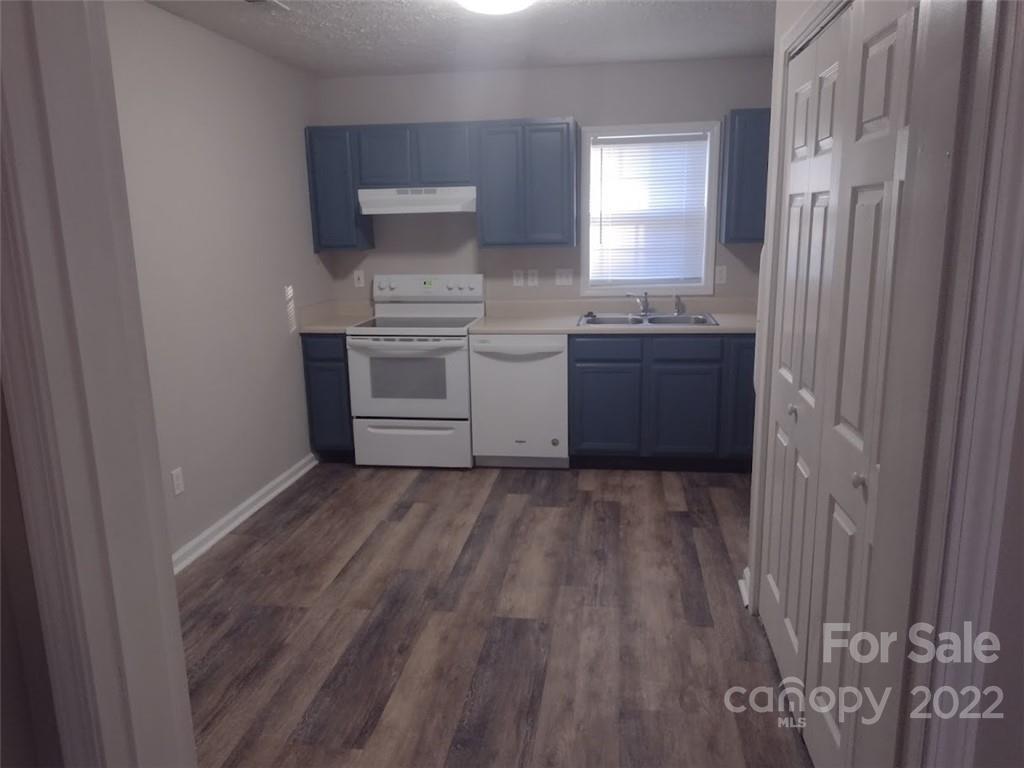 111 Sunset Drive Clover, SC 29710 - Photo 5 of 12 a kitchen with a sink and wooden floor