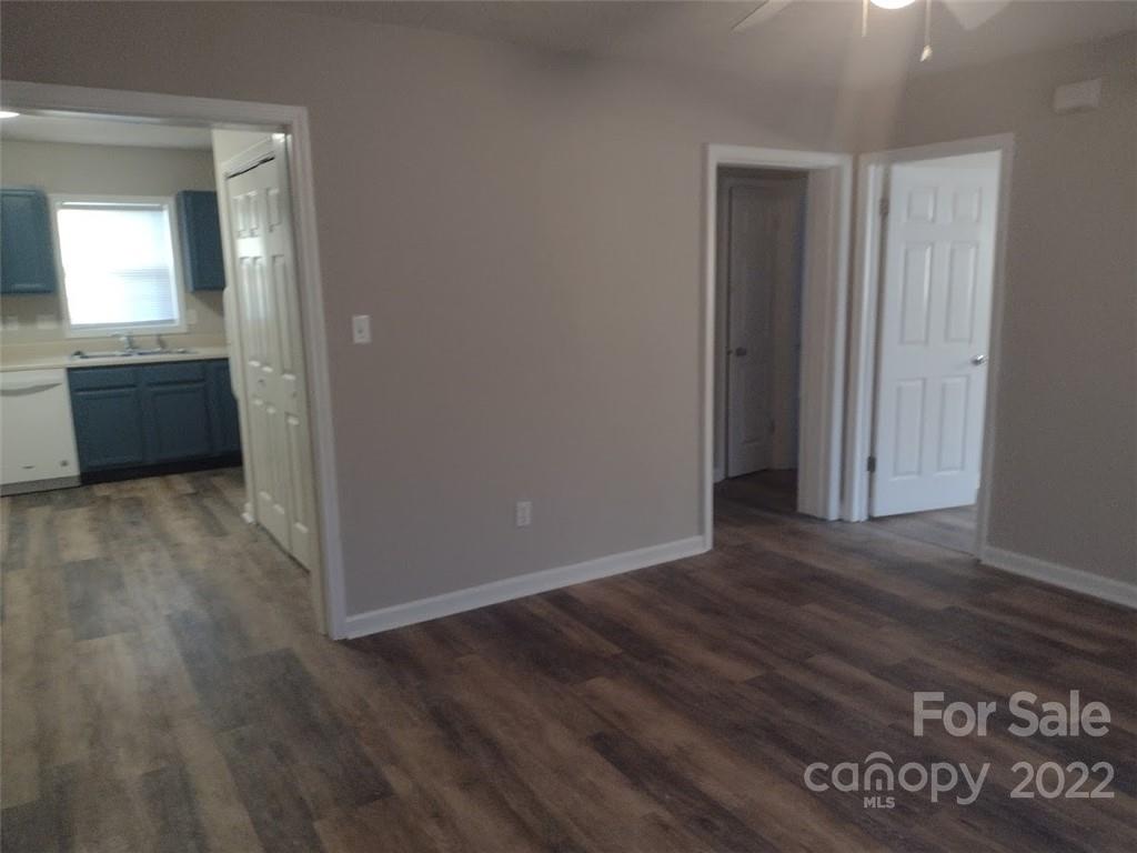 111 Sunset Drive Clover, SC 29710 - Photo 9 of 12 an empty room with wooden floor and a window