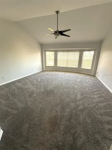 a spacious bathroom with a sink a mirror and a bathtub