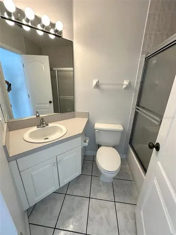 a bathroom with a shower and a toilet