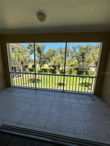 a view of a back yard from a balcony